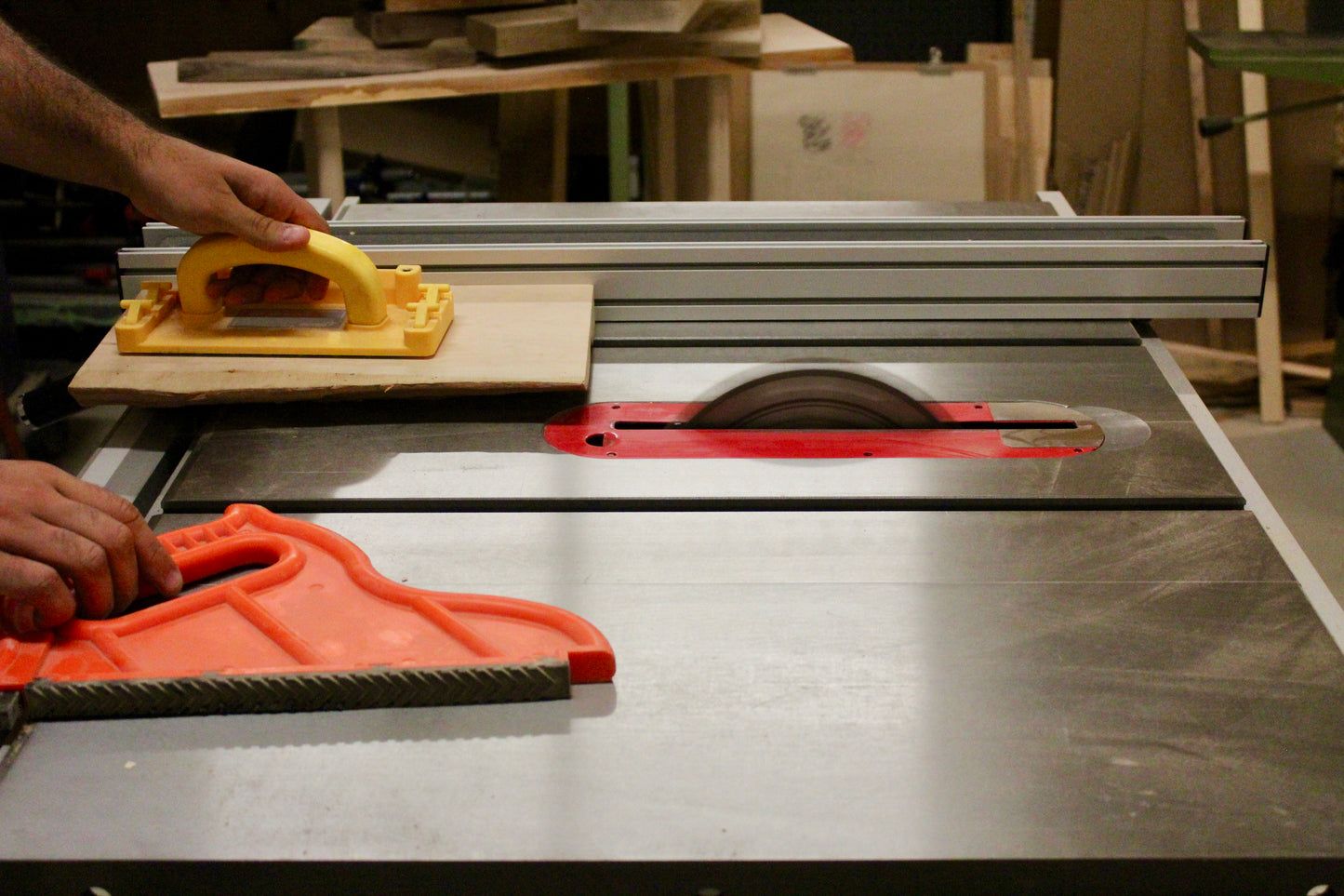 Safely cutting wood on table saw.