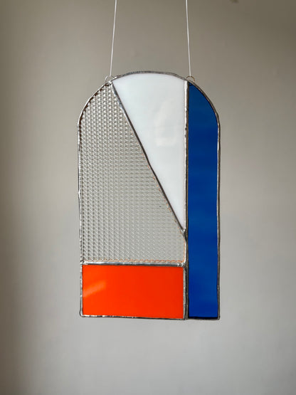 A piece of stained glass hung up 